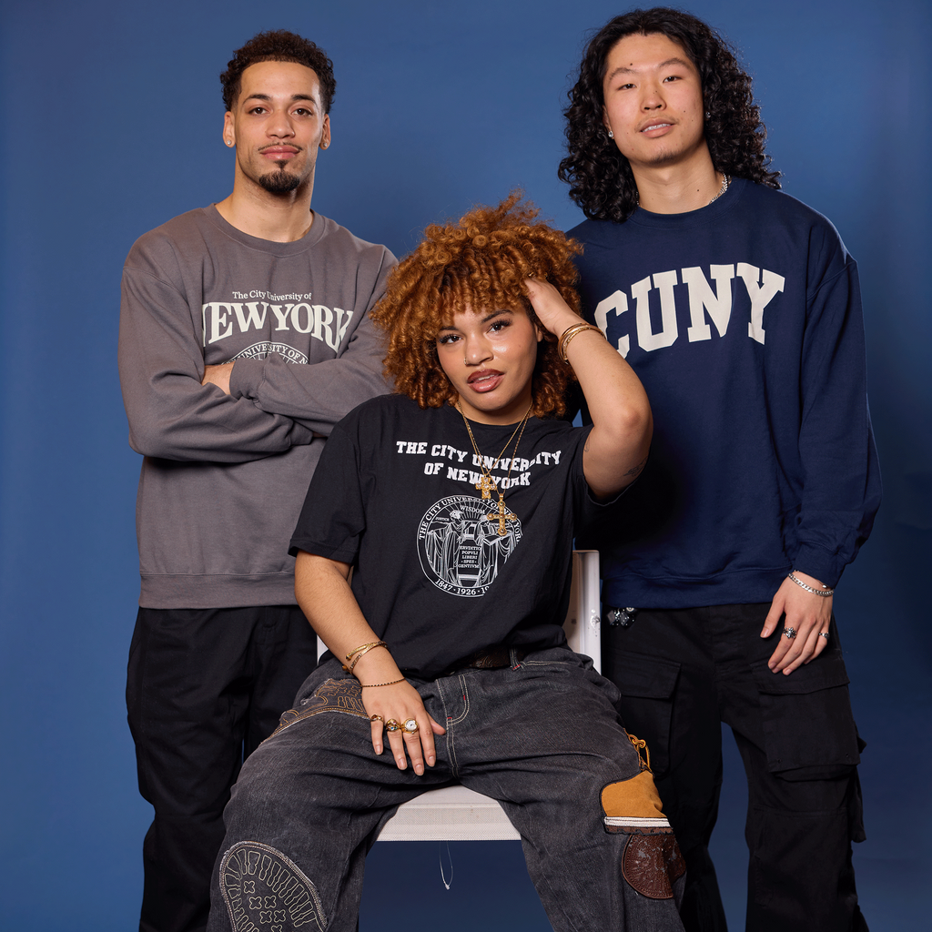 Three people wearing NYU and SUNY sweatshirts against a blue background